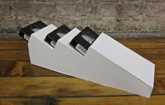 A mockup of a storage system for three VHS tapes