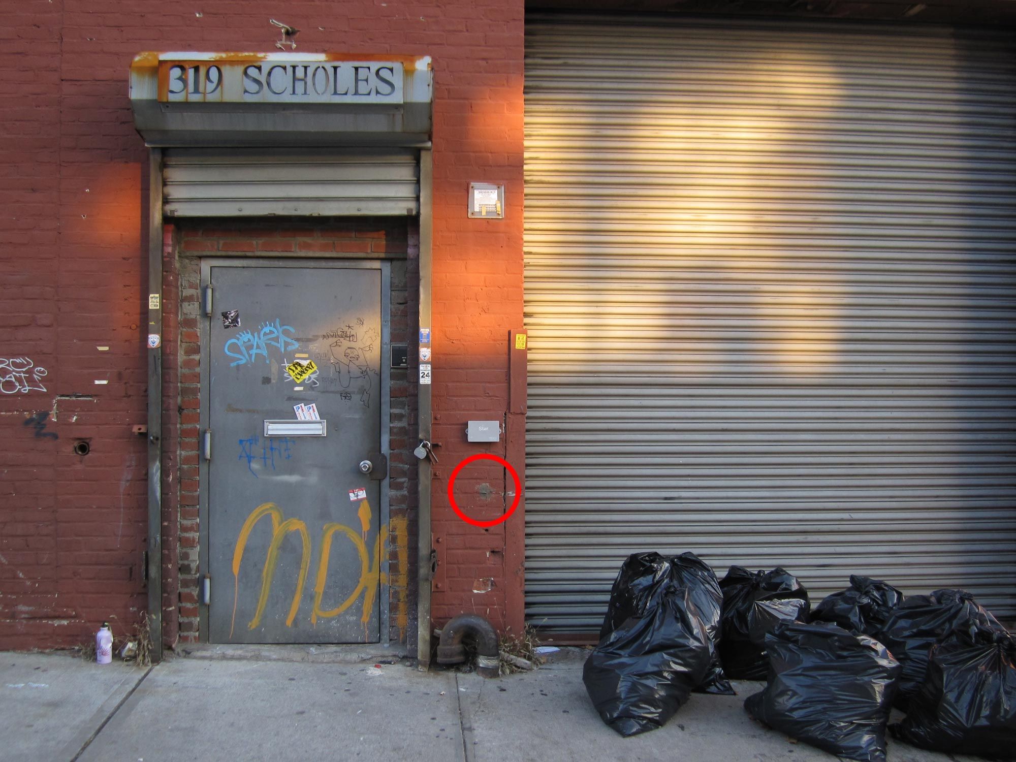 The door to 319 Scholes Street
