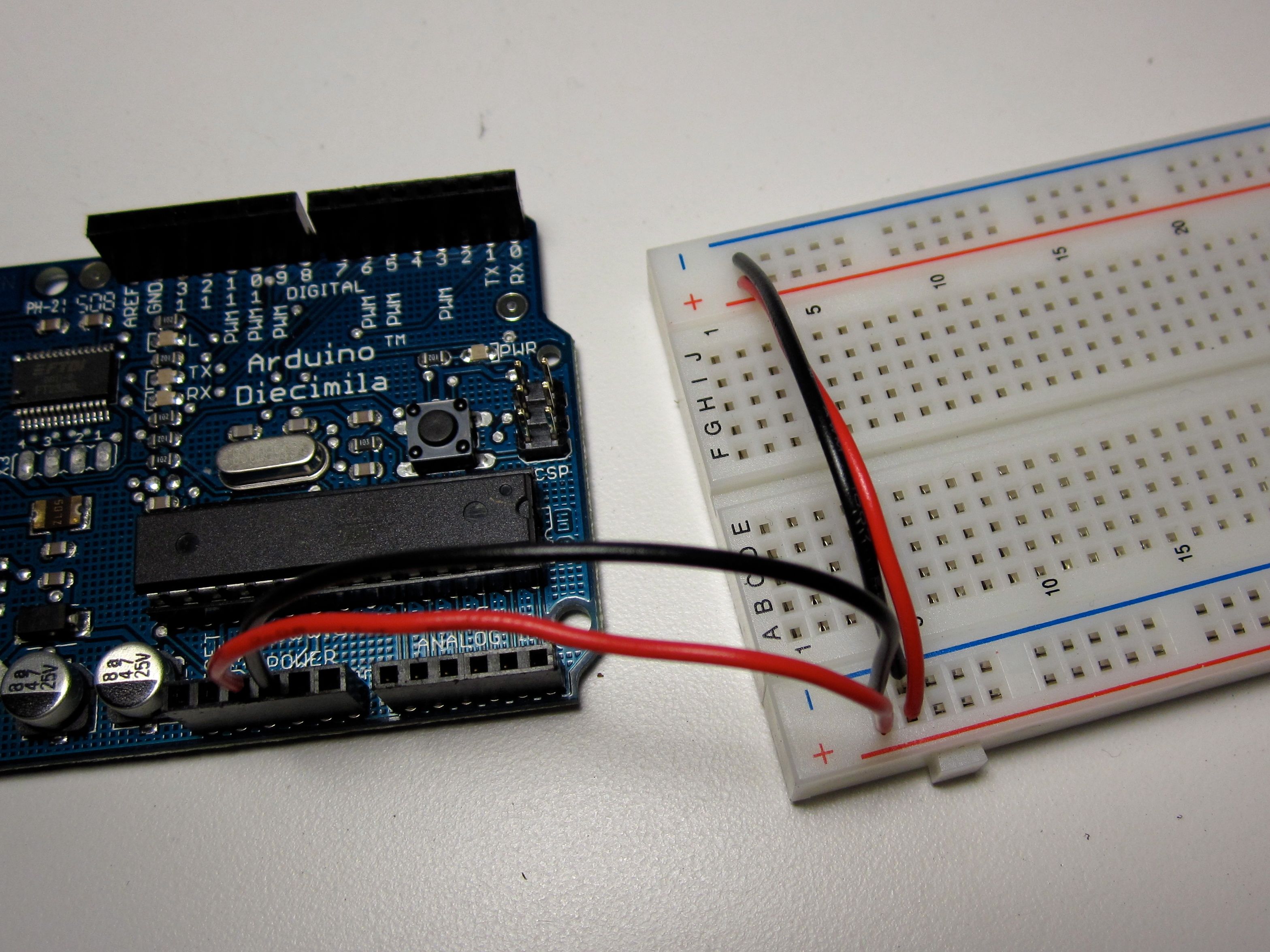 An Arduino connected to a breadboard