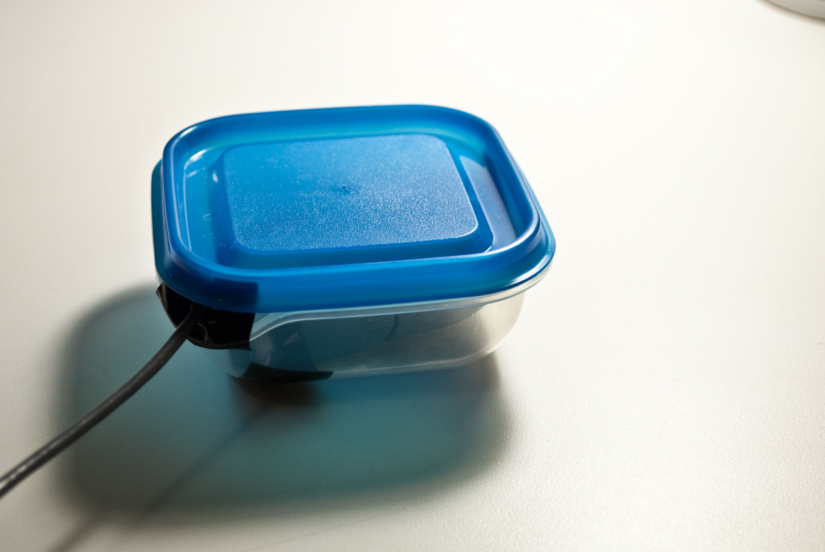 Camera in Tupperware enclosure with lid