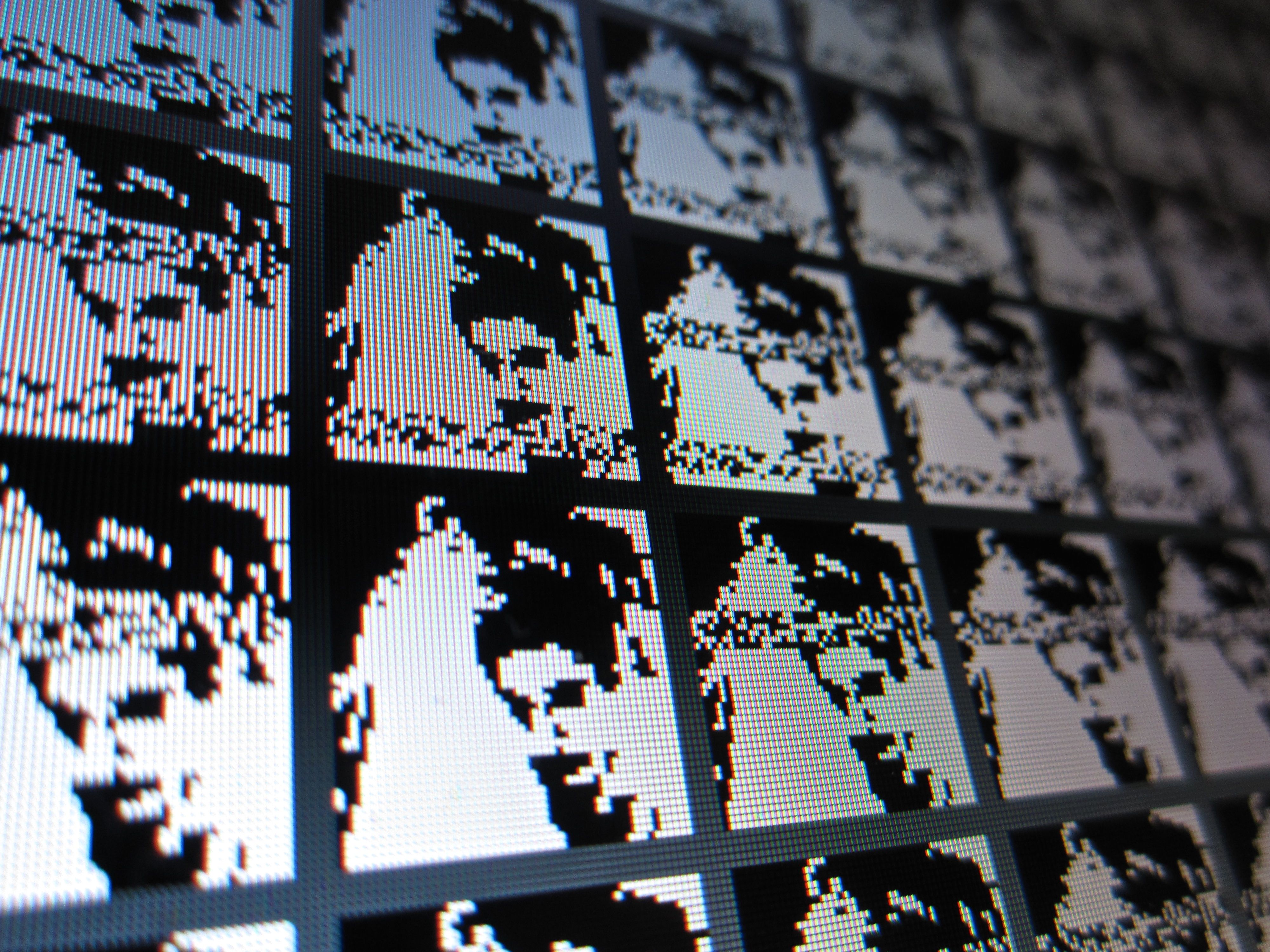 Grid of low-resolution face images in the All Thumbs interface