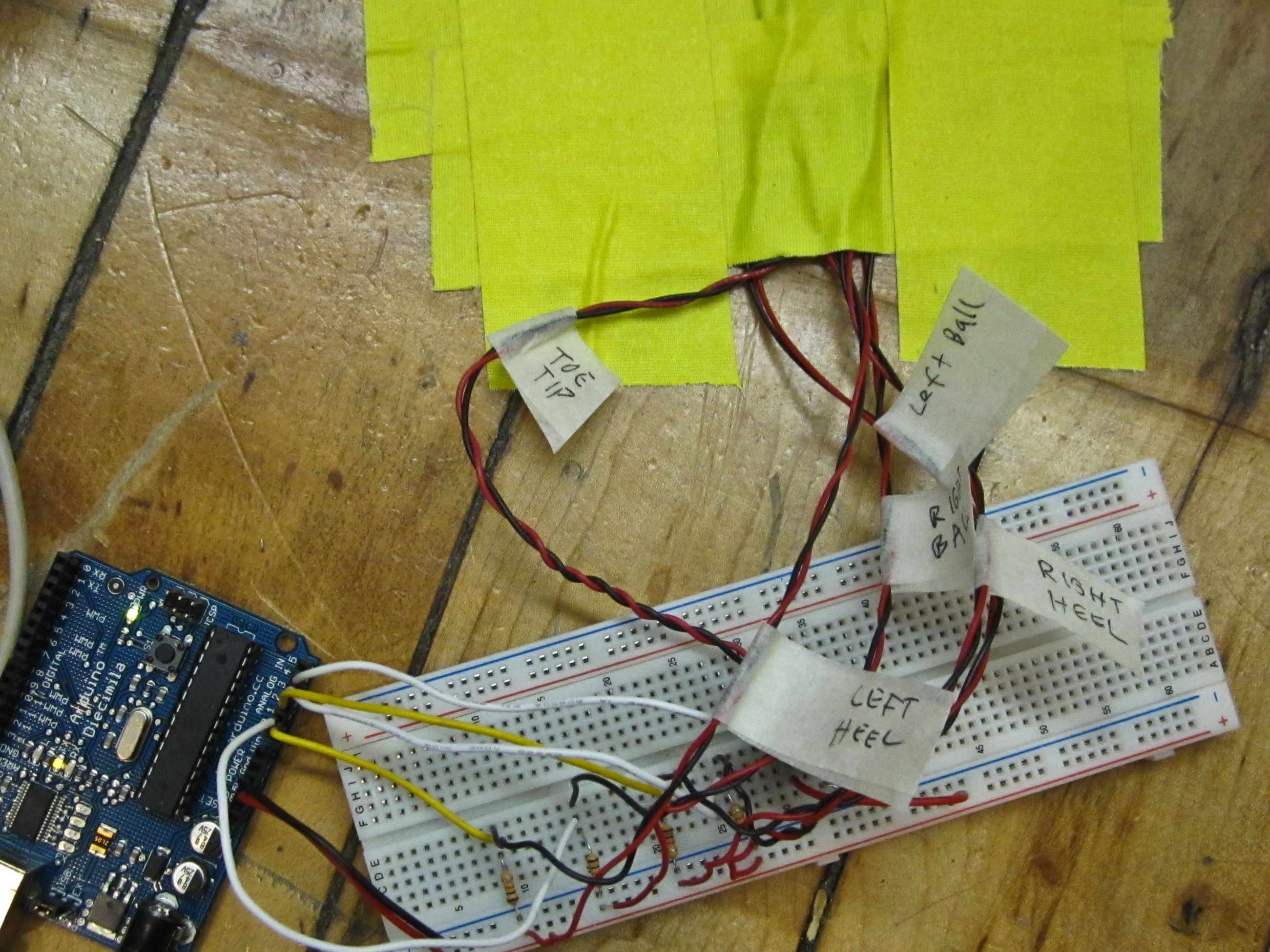 An arduino connected to a breadboard with myriad wires