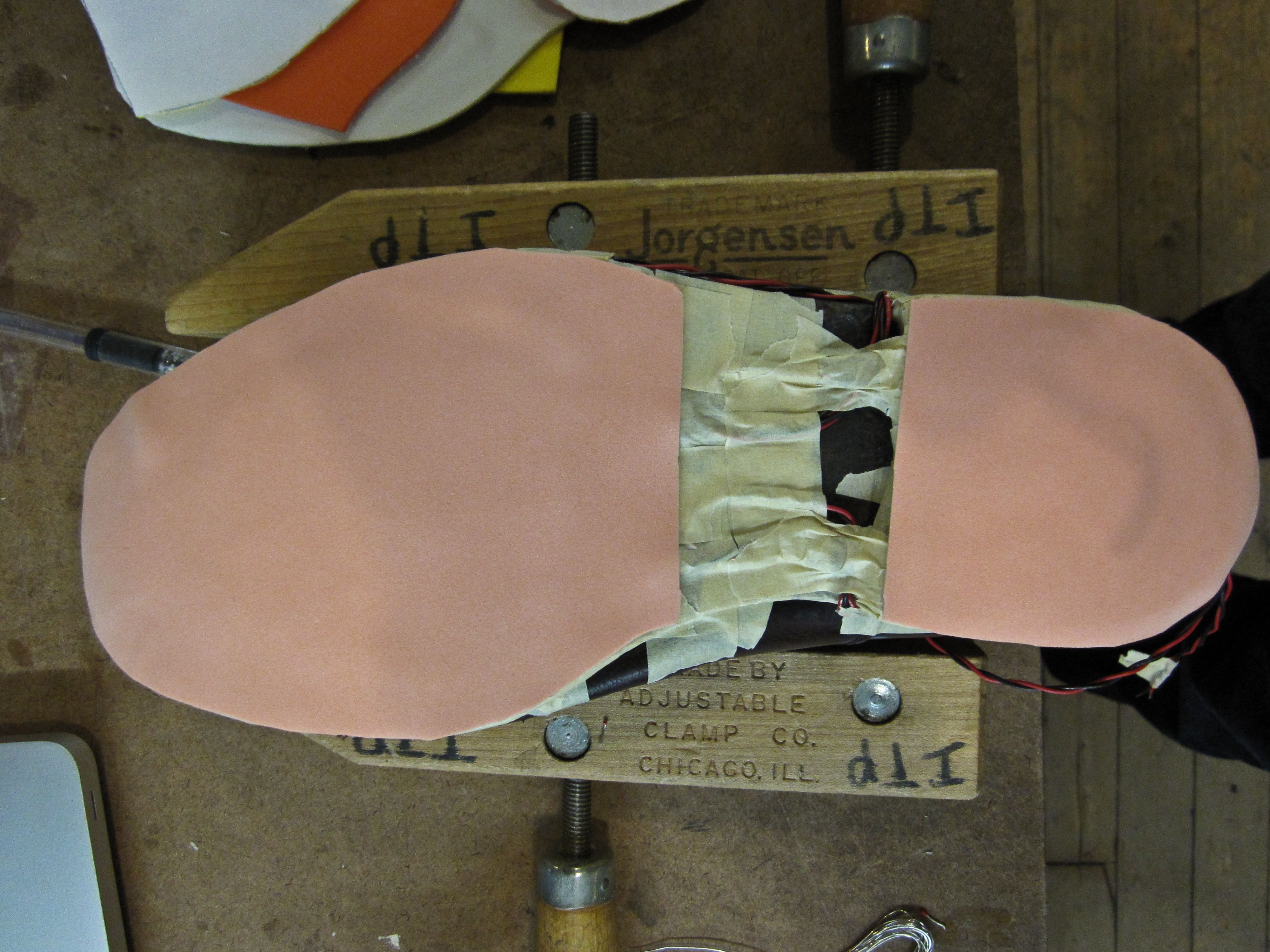 Foam layered over sensors on the bottom of a shoe