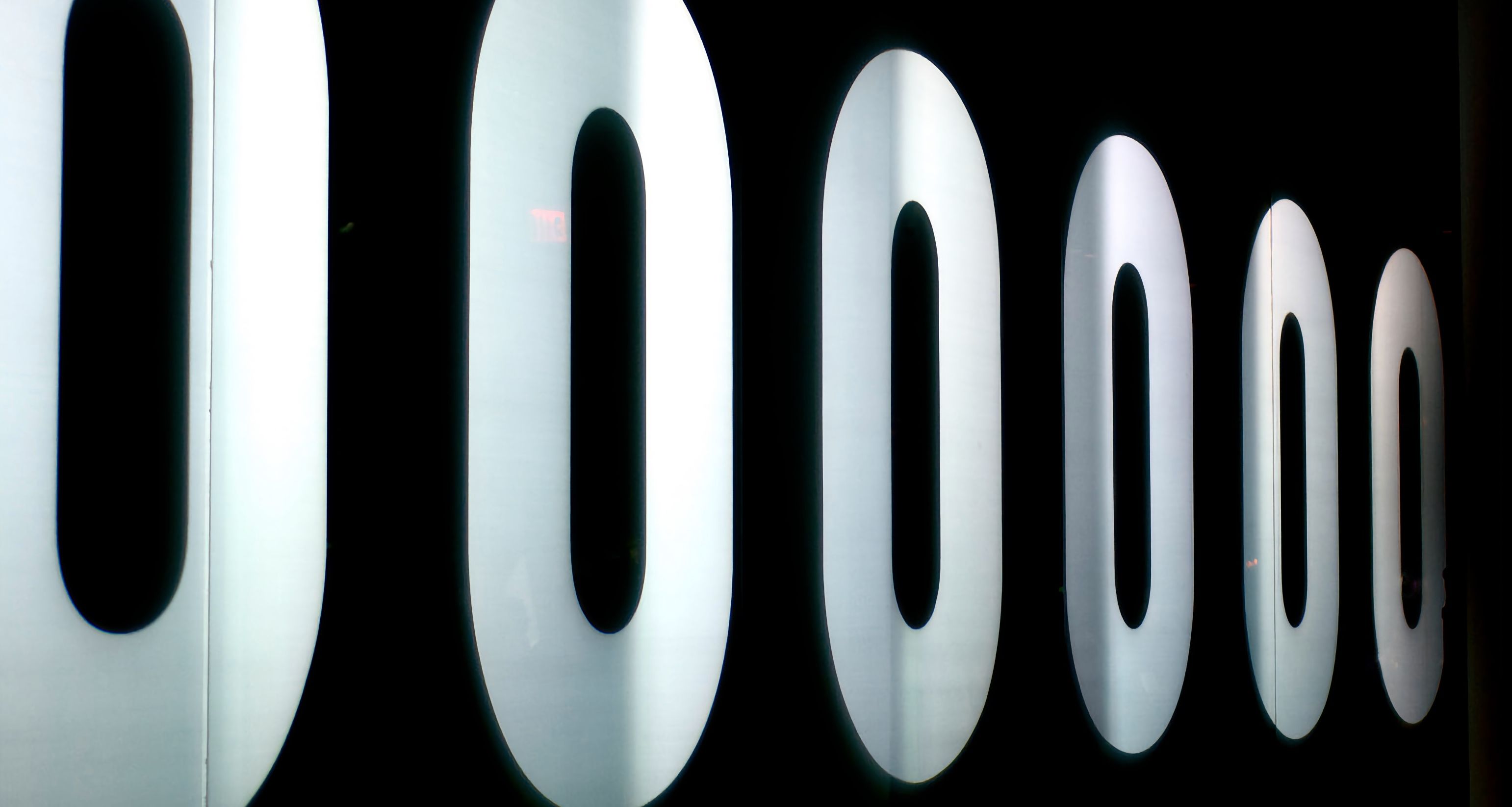 A video wall showing a series of large zero digits