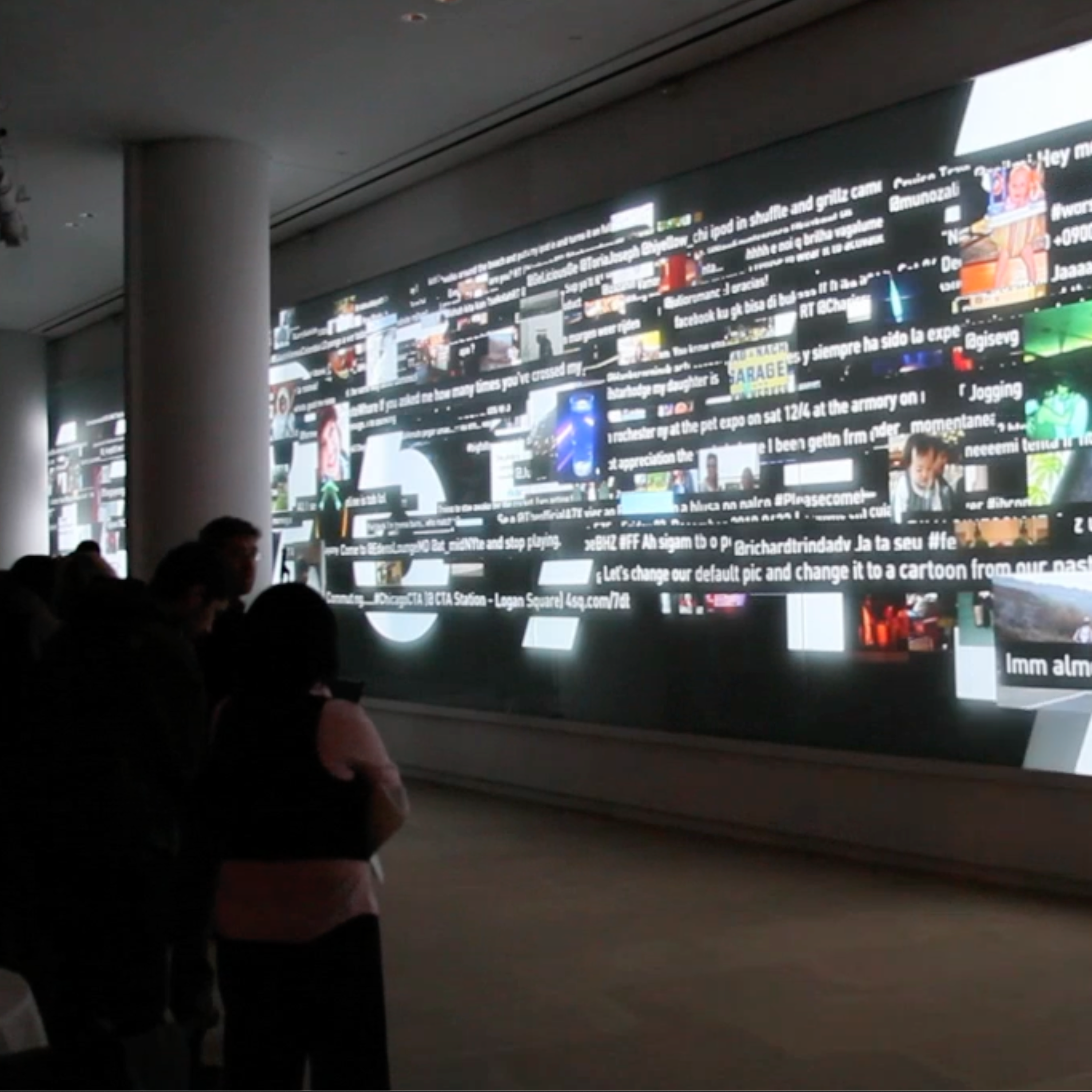 Words streaming across a room-size display.