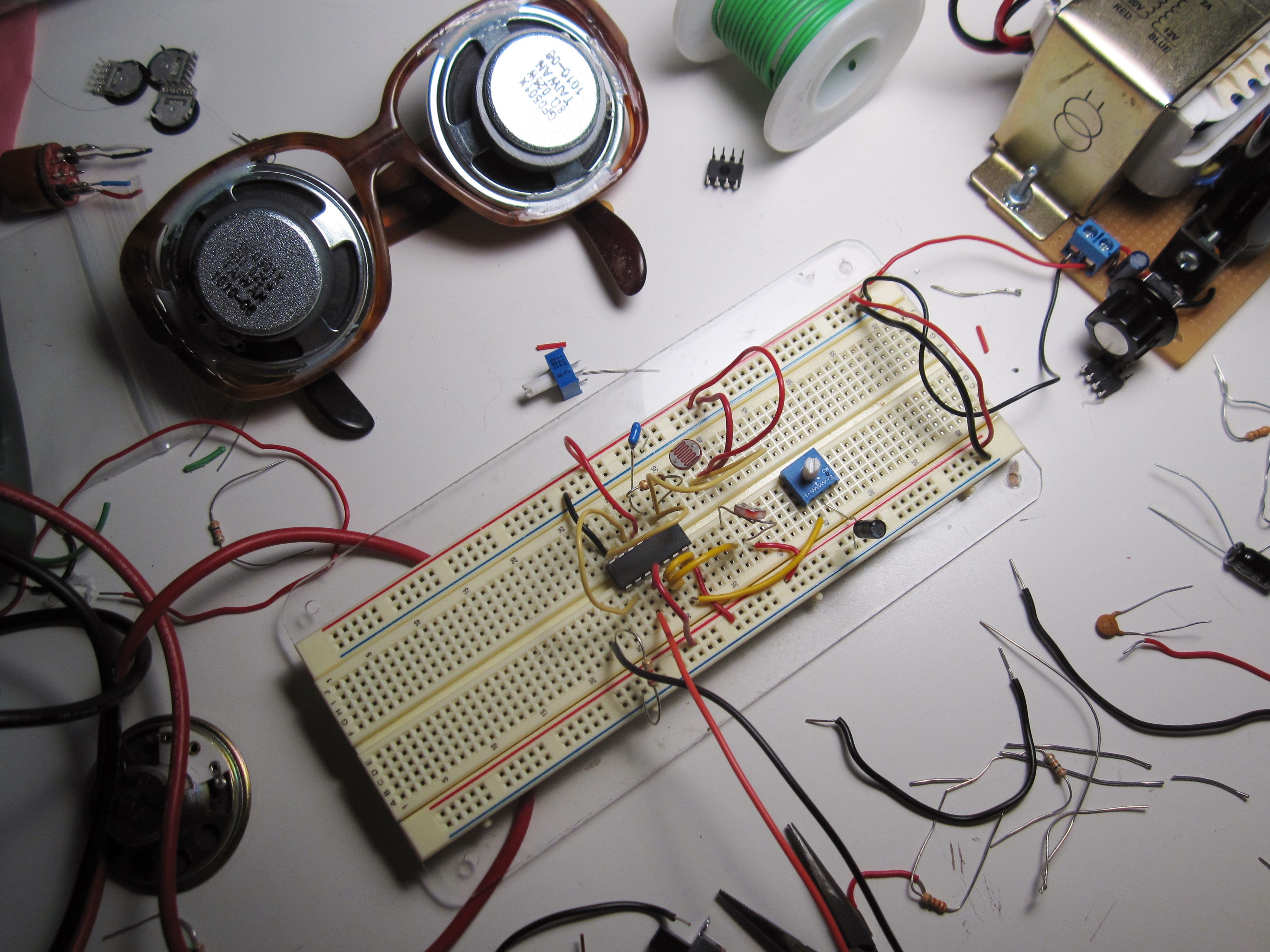 Synesthectacles under construction adjacent an circuit prototyping breadboard