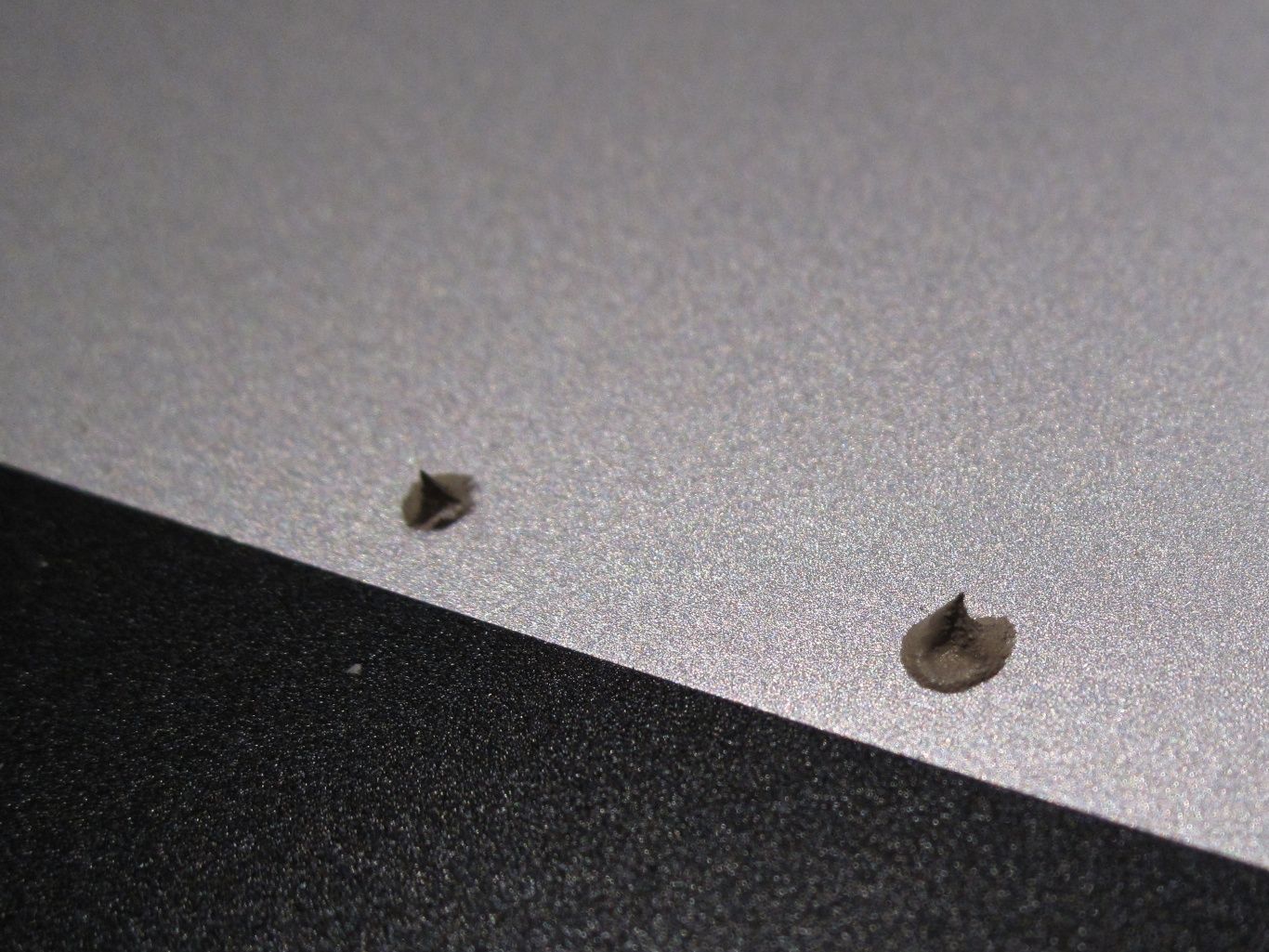 Conductive grease applied to laptop back case