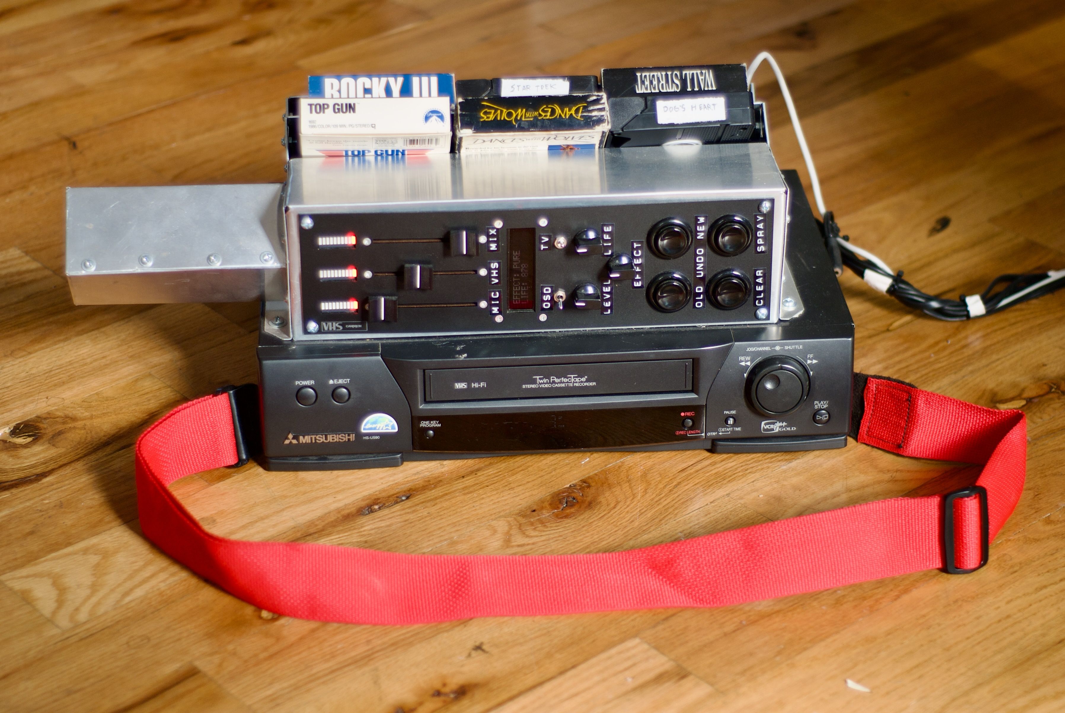 VHS Can(n)on hardware with VHS tape holster visible