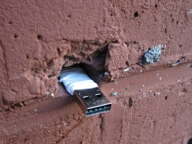 USB key placed in the wall at 319 Scholes Street