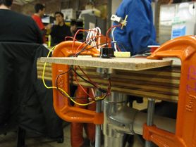 Buzz pot clamped to a table for testing