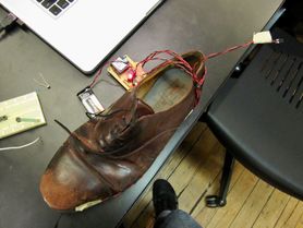 Top view of sensor-enabled shoes with wireless transmitter