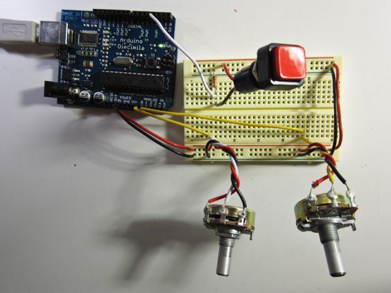 An Arduino connected to a breadboard with two potentiometers and a button