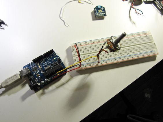 An Arduino connected to a breadboard and a potentiometer