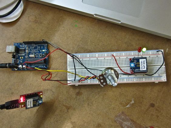 An Arduino connected to a potentiometer and a breadboard with an XBee radio