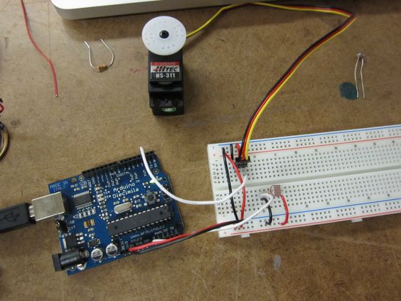 An Arduino connected to a breadboard connected to a servo