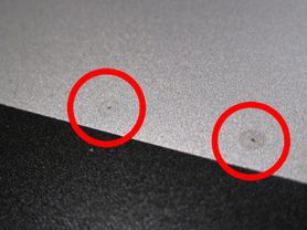 Laptop back case with points for application of conductive grease emphasized